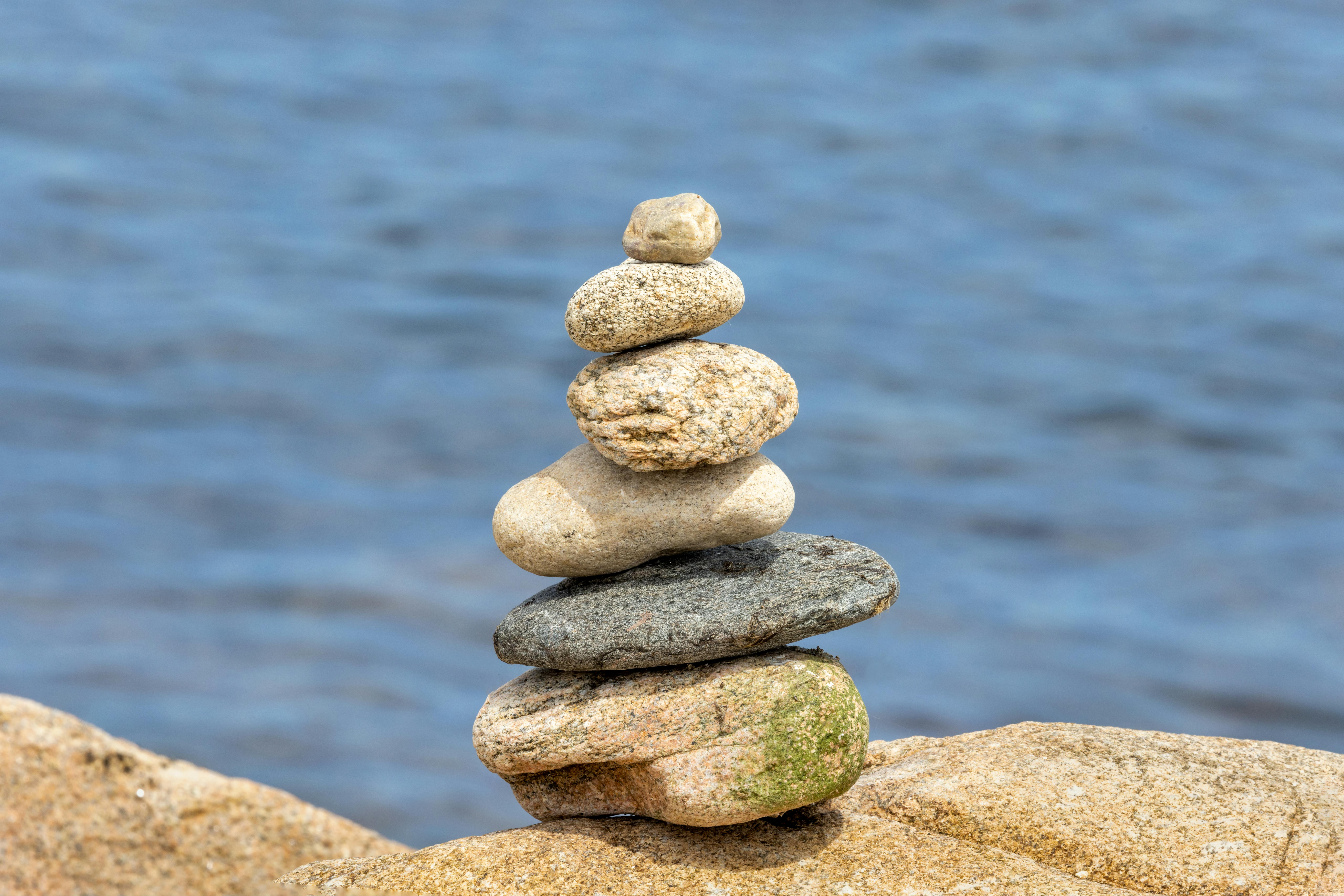 balancing rocks by the ocean