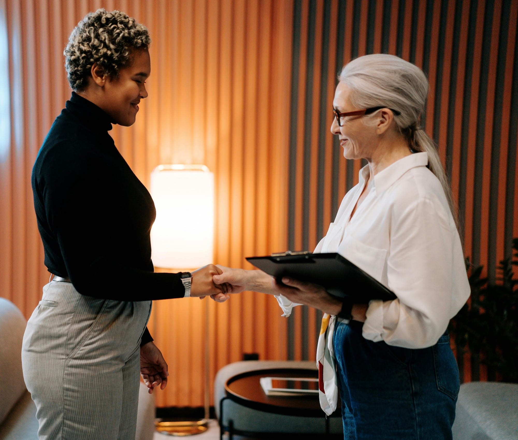 A therapist greeting a client for a first session