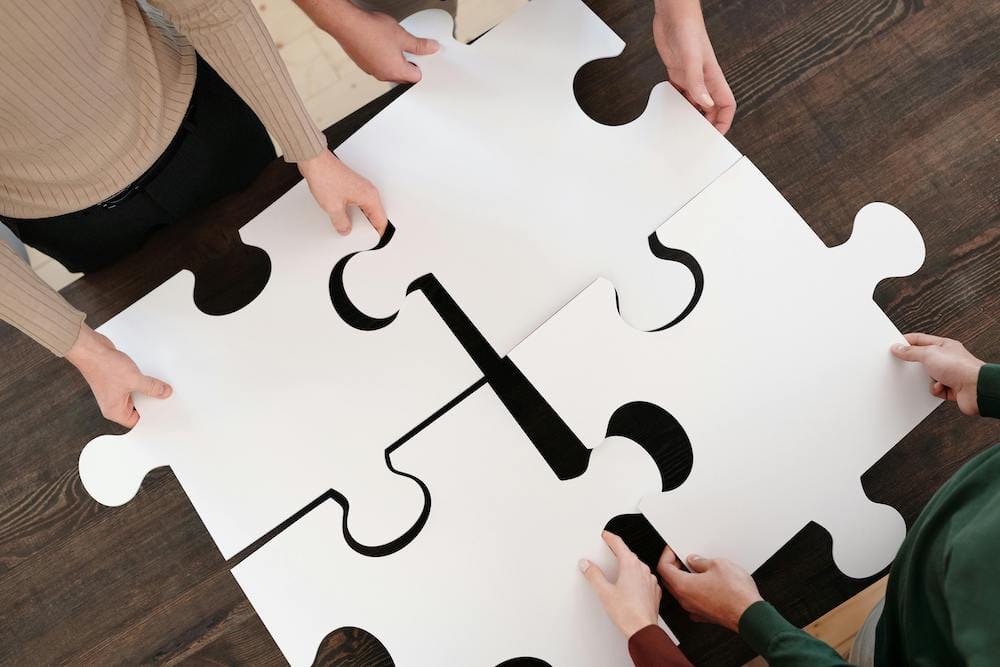 peole putting a huge puzzle together