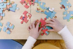 A child putting puzzle pieces together