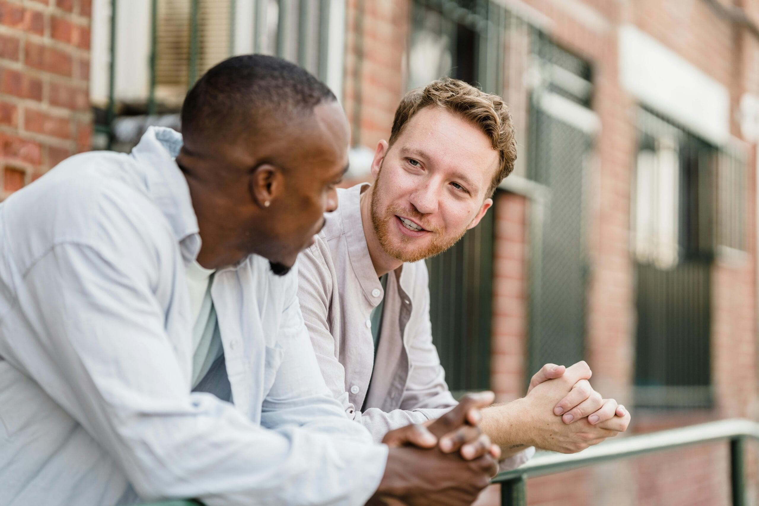 two men engaged in friendly conversation
