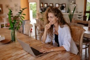 woman therapist writing a birp note at her computer